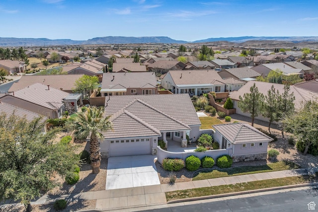 aerial perspective of suburban area with a mountainous background