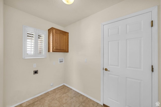 laundry area with cabinet space, electric dryer hookup, baseboards, and washer hookup