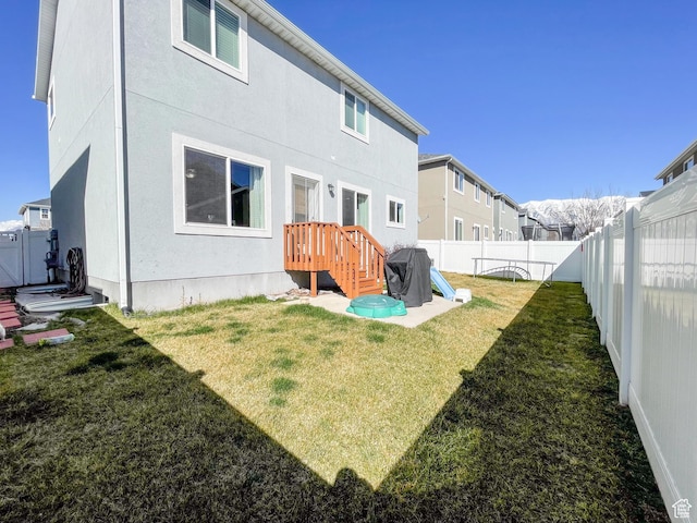 446 E Rue De Paris, Vineyard, UT 84059 - rear view of house with a lawn, stucco siding, and a fenced backyard