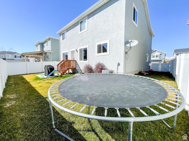 446 E Rue De Paris, Vineyard, UT 84059 - back of house with a yard, stucco siding, and a fenced backyard