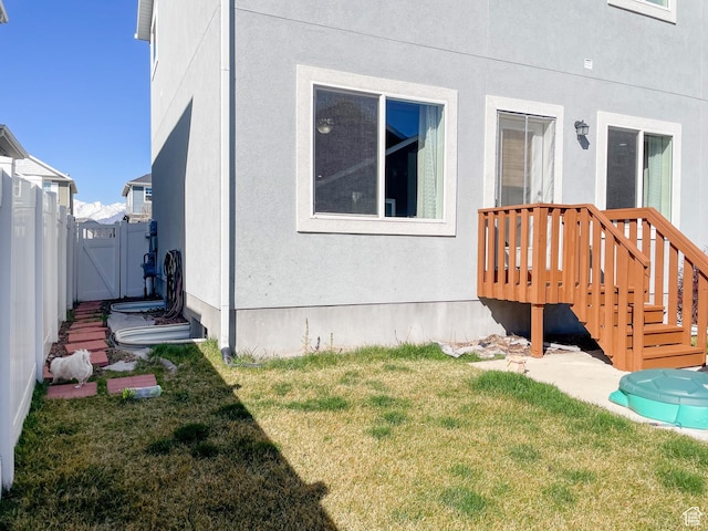 446 E Rue De Paris, Vineyard, UT 84059 - exterior space with a lawn, fence, a gate, and stucco siding