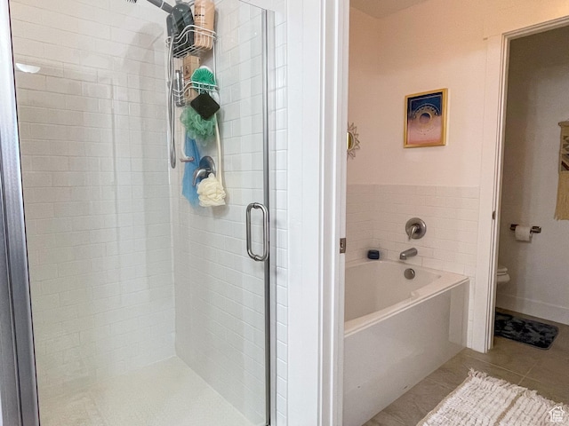 446 E Rue De Paris, Vineyard, UT 84059 - bathroom featuring toilet, a bath, a shower stall, and tile patterned floors