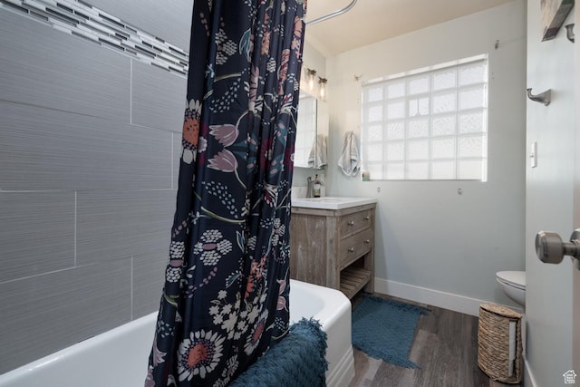 380 S 100 E, Vernal, UT 84078 - full bath with vanity, toilet, baseboards, shower / bath combo, and wood finished floors