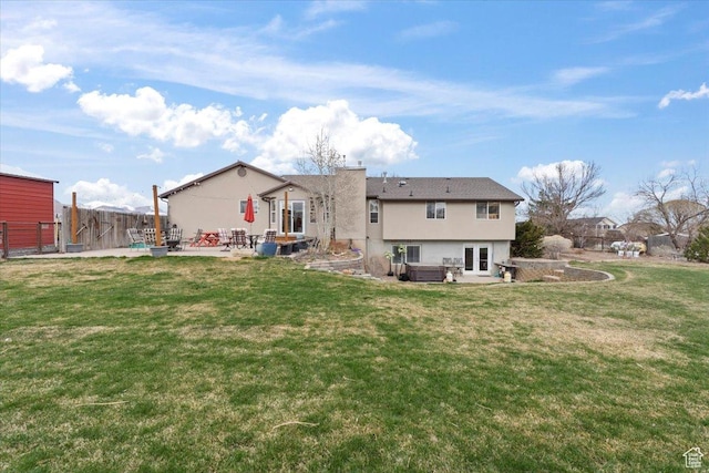 7217 W Mccuiston Ave S, Herriman, UT 84096 - back of house featuring fence, stucco siding, a patio area, and a lawn