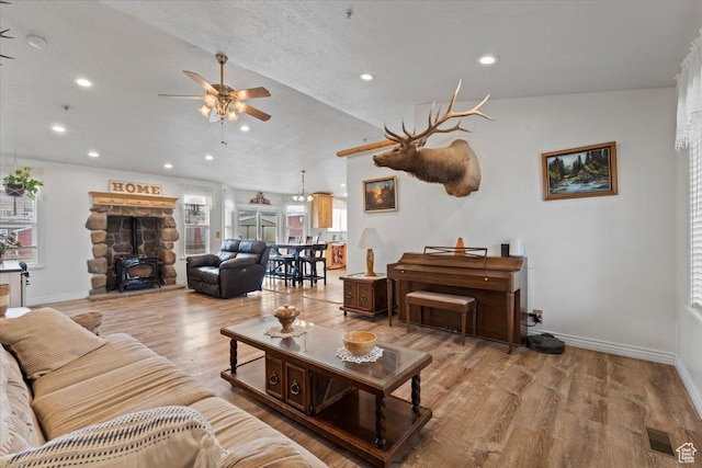 7217 W Mccuiston Ave S, Herriman, UT 84096 - living area featuring ceiling fan, wood finished floors, recessed lighting, lofted ceiling, and a wood stove