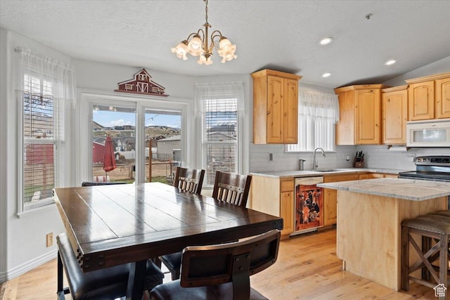7217 W Mccuiston Ave S, Herriman, UT 84096 - dining area with light wood finished floors, a textured ceiling, baseboards, recessed lighting, and an inviting chandelier