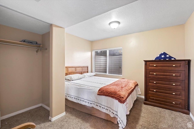 7217 W Mccuiston Ave S, Herriman, UT 84096 - carpeted bedroom featuring baseboards and a textured ceiling