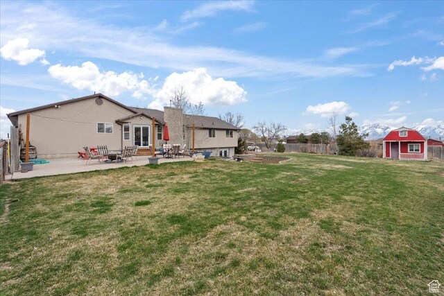 7217 W Mccuiston Ave S, Herriman, UT 84096 - view of yard with a patio area, a shed, fence, an outdoor structure, and entry steps