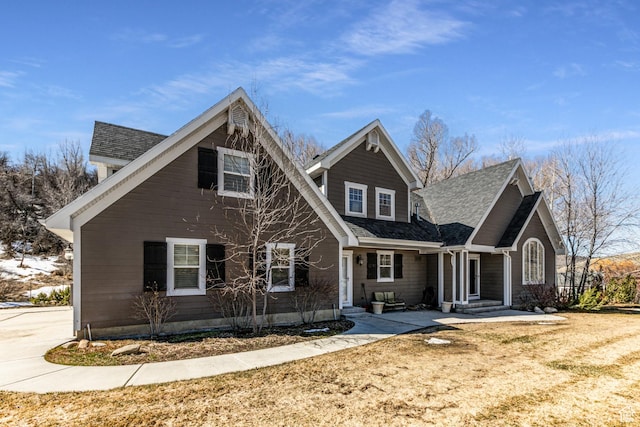 traditional home with roof with shingles