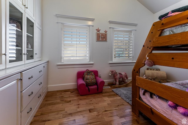 2503 W State Road 32, Peoa, UT 84061 - bedroom with baseboards, lofted ceiling, and light wood-style floors