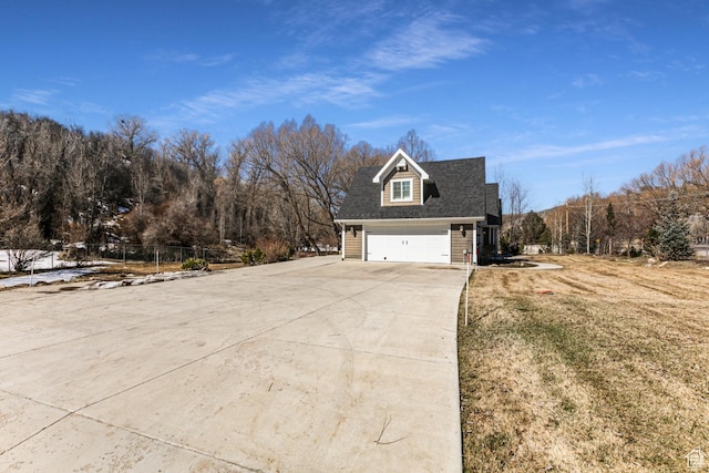 2503 W State Road 32, Peoa, UT 84061 - view of side of home with fence, a yard, a garage, and concrete driveway