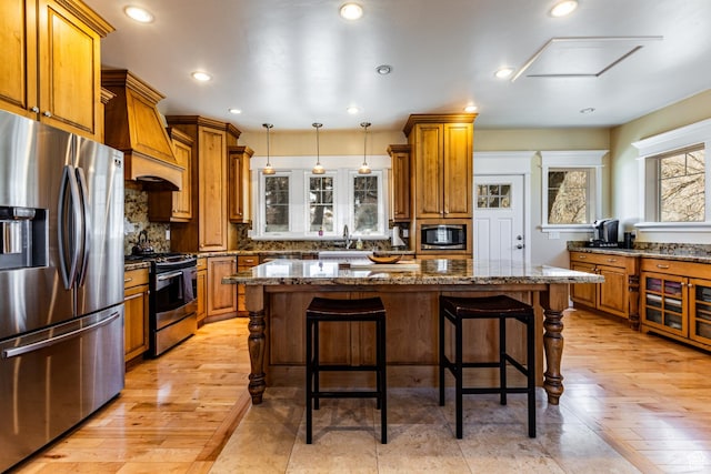 2503 W State Road 32, Peoa, UT 84061 - kitchen with appliances with stainless steel finishes, brown cabinetry, tasteful backsplash, and recessed lighting