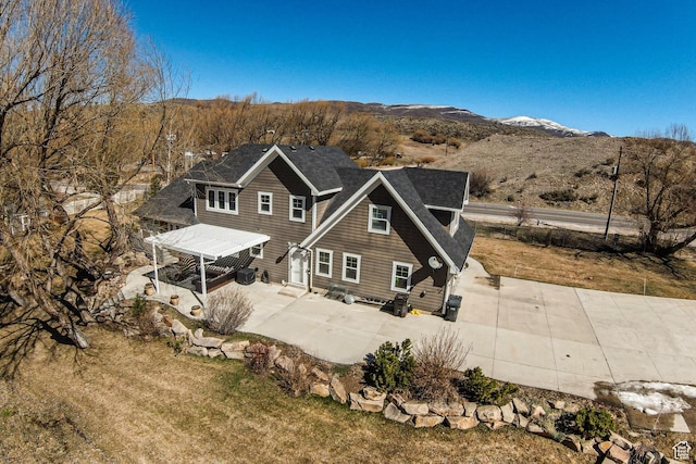2503 W State Road 32, Peoa, UT 84061 - back of property with a patio area, a mountain view, and a yard