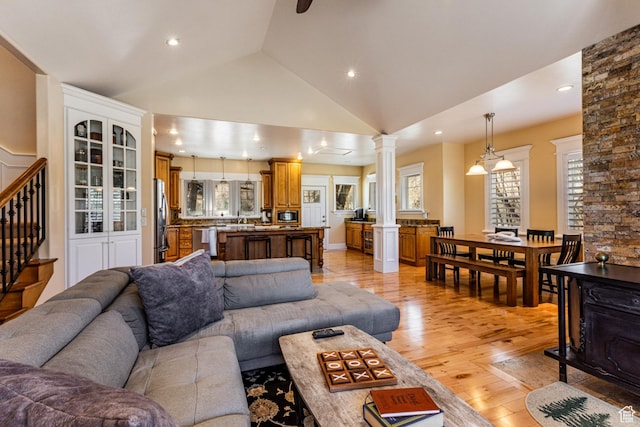 2503 W State Road 32, Peoa, UT 84061 - living room with stairway, recessed lighting, ornate columns, high vaulted ceiling, and light wood finished floors