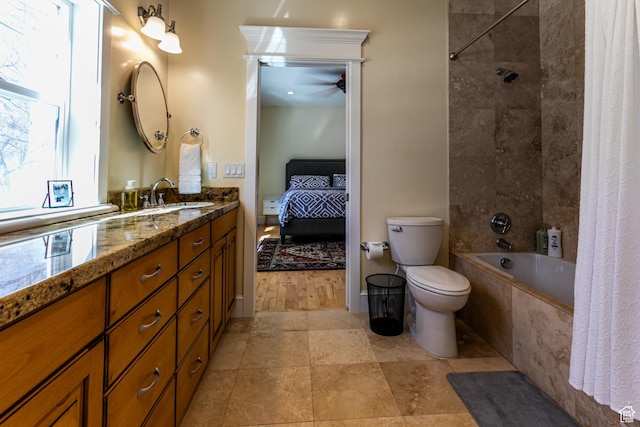 2503 W State Road 32, Peoa, UT 84061 - ensuite bathroom with connected bathroom, toilet, vanity, ceiling fan, and tiled shower / bath