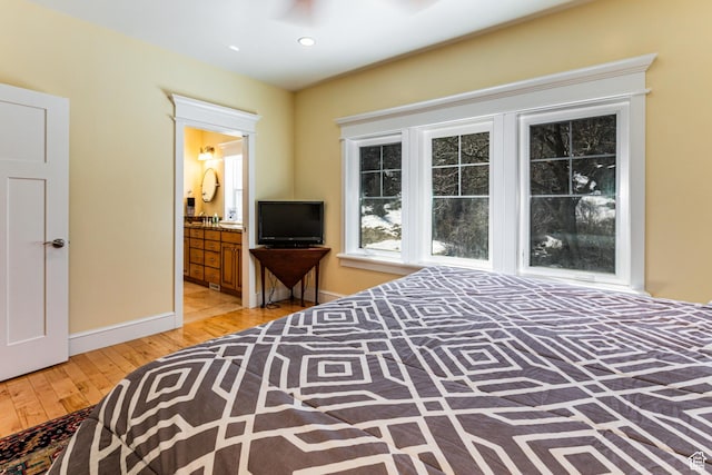 2503 W State Road 32, Peoa, UT 84061 - bedroom with recessed lighting, ensuite bath, baseboards, and light wood-type flooring