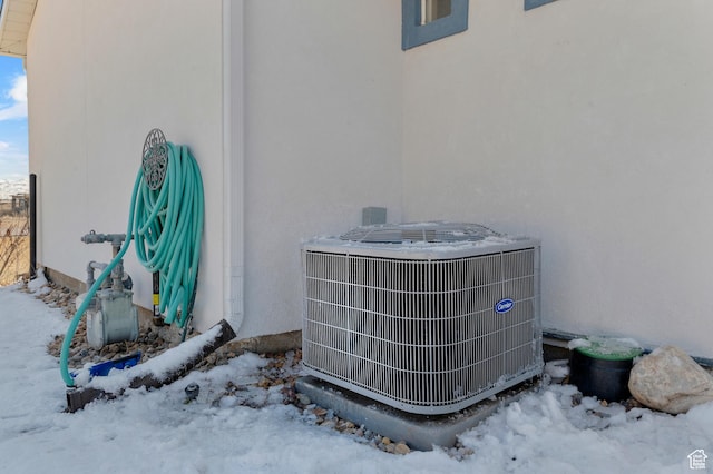 details with stucco siding and central AC unit