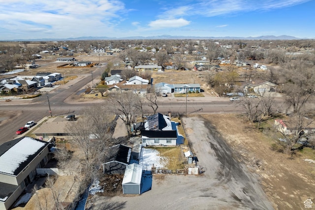 drone / aerial view featuring a residential view and a mountain view