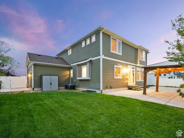 1146 W 1875 S, Syracuse, UT 84075 - back of house with a lawn, fence, a patio area, entry steps, and a gazebo