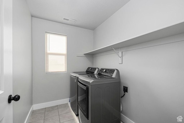 1146 W 1875 S, Syracuse, UT 84075 - laundry area with laundry area, visible vents, baseboards, separate washer and dryer, and light tile patterned floors