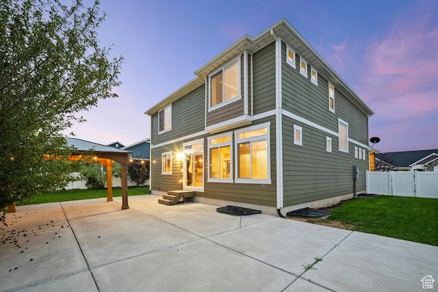 1146 W 1875 S, Syracuse, UT 84075 - back of property with a patio, a gate, a lawn, and fence