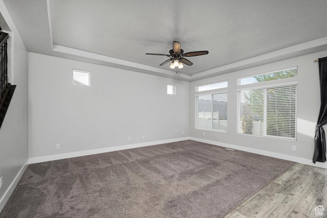 1146 W 1875 S, Syracuse, UT 84075 - spare room featuring a ceiling fan, baseboards, and a raised ceiling