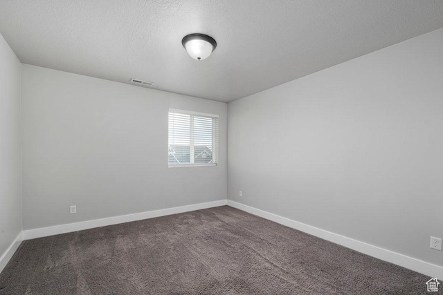 1146 W 1875 S, Syracuse, UT 84075 - unfurnished room with baseboards, dark colored carpet, a textured ceiling, and visible vents