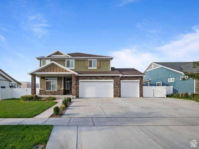 1146 W 1875 S, Syracuse, UT 84075 - craftsman inspired home with a front lawn, fence, stone siding, and concrete driveway