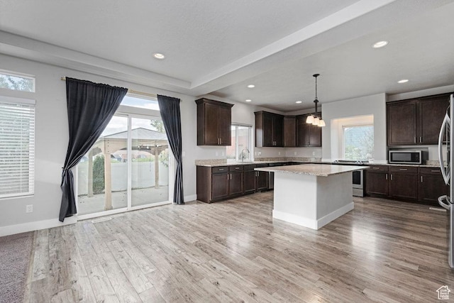 1146 W 1875 S, Syracuse, UT 84075 - kitchen featuring a sink, dark brown cabinetry, a healthy amount of sunlight, and stainless steel appliances