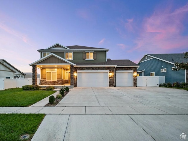 1146 W 1875 S, Syracuse, UT 84075 - view of front of home with fence, a lawn, a gate, and concrete driveway