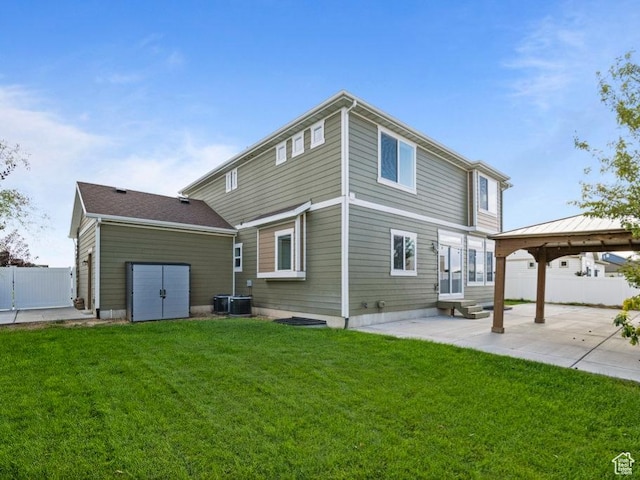 1146 W 1875 S, Syracuse, UT 84075 - rear view of property featuring a lawn, fence, a patio, and a gazebo
