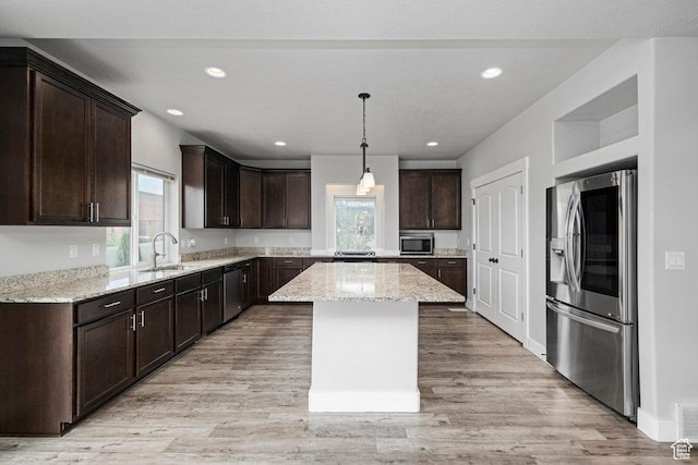 1146 W 1875 S, Syracuse, UT 84075 - kitchen featuring stainless steel appliances, dark brown cabinetry, plenty of natural light, and a sink