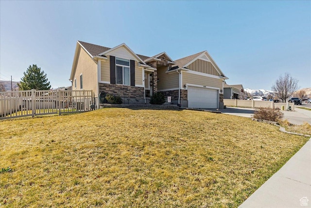 6403 W Muzzle Loader Dr, Herriman, UT 84096 - craftsman inspired home with a front yard, stone siding, concrete driveway, and fence