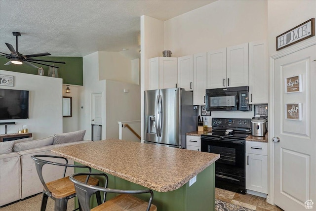6403 W Muzzle Loader Dr, Herriman, UT 84096 - kitchen with open floor plan, a kitchen island, black appliances, high vaulted ceiling, and a breakfast bar area