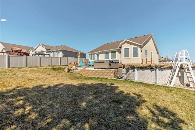 6403 W Muzzle Loader Dr, Herriman, UT 84096 - view of yard with fence, a patio area, and a hot tub