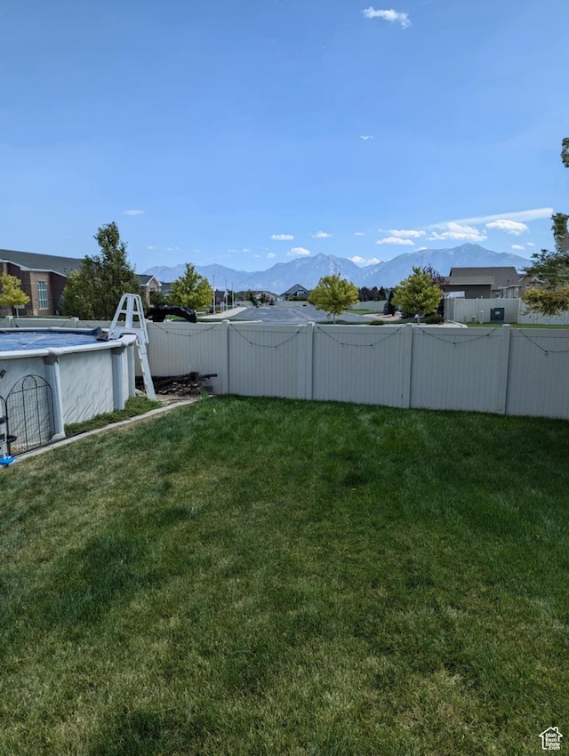 6403 W Muzzle Loader Dr, Herriman, UT 84096 - view of yard with fence and a mountain view