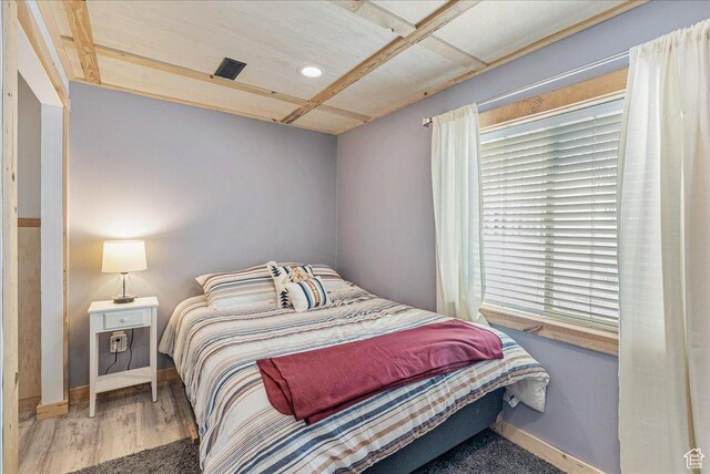 6403 W Muzzle Loader Dr, Herriman, UT 84096 - bedroom with wood finished floors, baseboards, and multiple windows