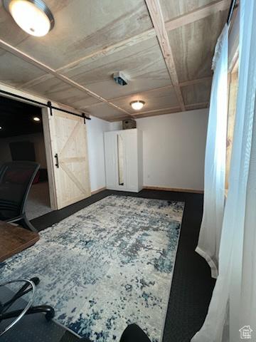 6403 W Muzzle Loader Dr, Herriman, UT 84096 - interior space with a barn door and baseboards