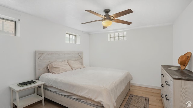 4535 S Ridgeline Dr, Ogden, UT 84405 - bedroom featuring baseboards, ceiling fan, and light wood-type flooring