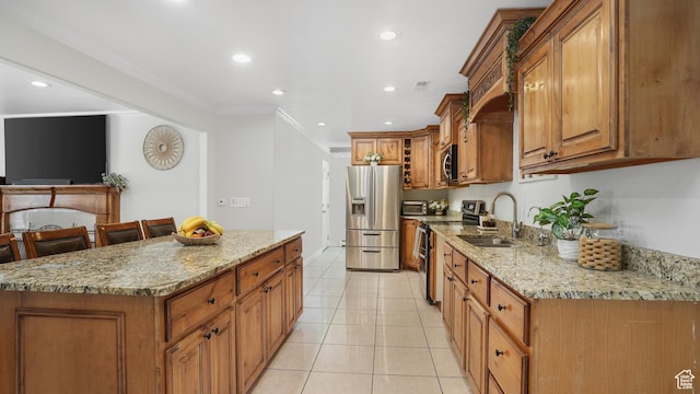 4535 S Ridgeline Dr, Ogden, UT 84405 - kitchen featuring a sink, stainless steel appliances, brown cabinetry, and crown molding
