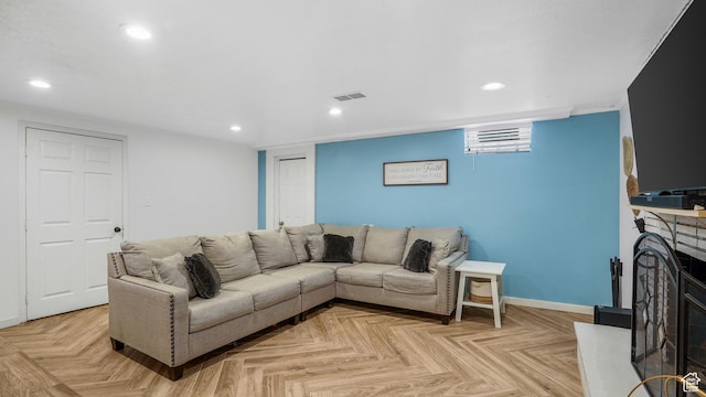 4535 S Ridgeline Dr, Ogden, UT 84405 - living room with recessed lighting, a fireplace with raised hearth, baseboards, and visible vents