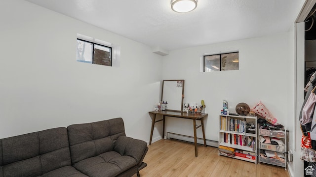 4535 S Ridgeline Dr, Ogden, UT 84405 - living area with a baseboard radiator and wood finished floors