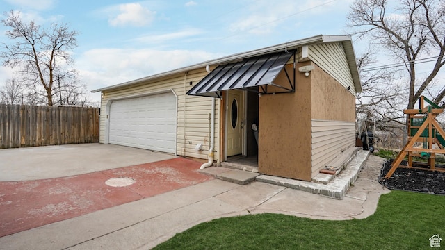 4535 S Ridgeline Dr, Ogden, UT 84405 - view of front of house with driveway, fence, and a playground