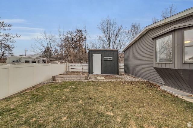 175 E Millerberg Dr S, Sandy, UT 84070 - view of yard featuring an outbuilding, a storage unit, a fenced backyard, and a vegetable garden