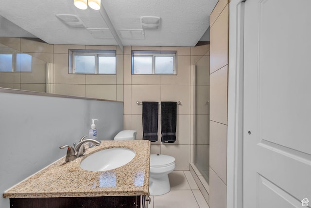175 E Millerberg Dr S, Sandy, UT 84070 - full bath featuring tile walls, a textured ceiling, toilet, tile patterned floors, and a stall shower