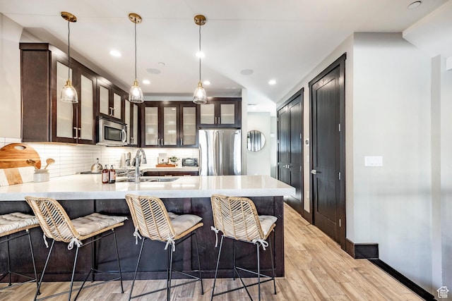 3788 Blackstone Dr Unit 19, Park City, UT 84098 - kitchen with a sink, light countertops, appliances with stainless steel finishes, and a peninsula