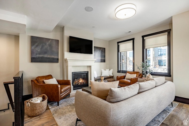 3788 Blackstone Dr Unit 19, Park City, UT 84098 - living room featuring a glass covered fireplace, visible vents, and wood finished floors