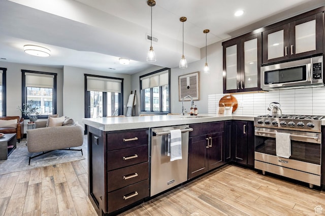 3788 Blackstone Dr Unit 19, Park City, UT 84098 - kitchen with a peninsula, light countertops, visible vents, appliances with stainless steel finishes, and a sink