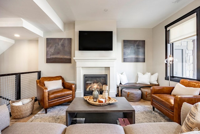 living area with a glass covered fireplace