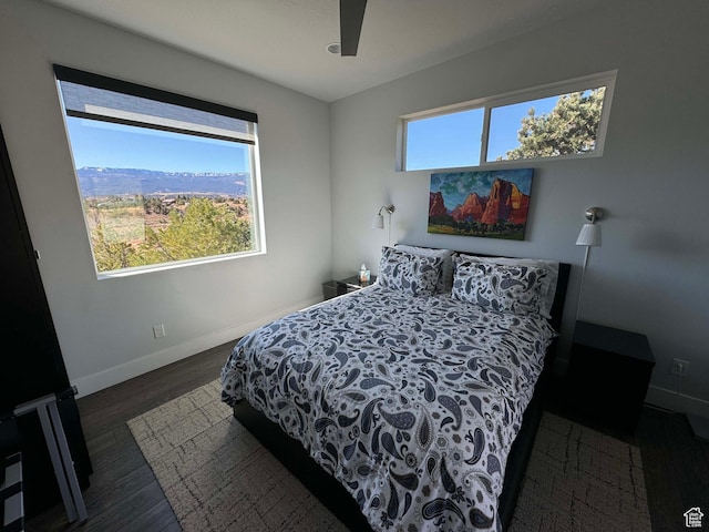 405 W 1000 N, Torrey, UT 84775 - bedroom featuring baseboards, multiple windows, and wood finished floors